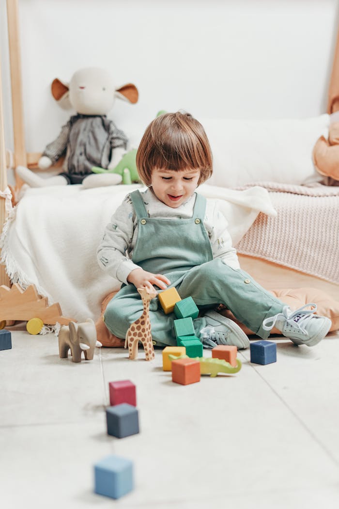 Young child enjoying playtime with colorful wooden toys indoors