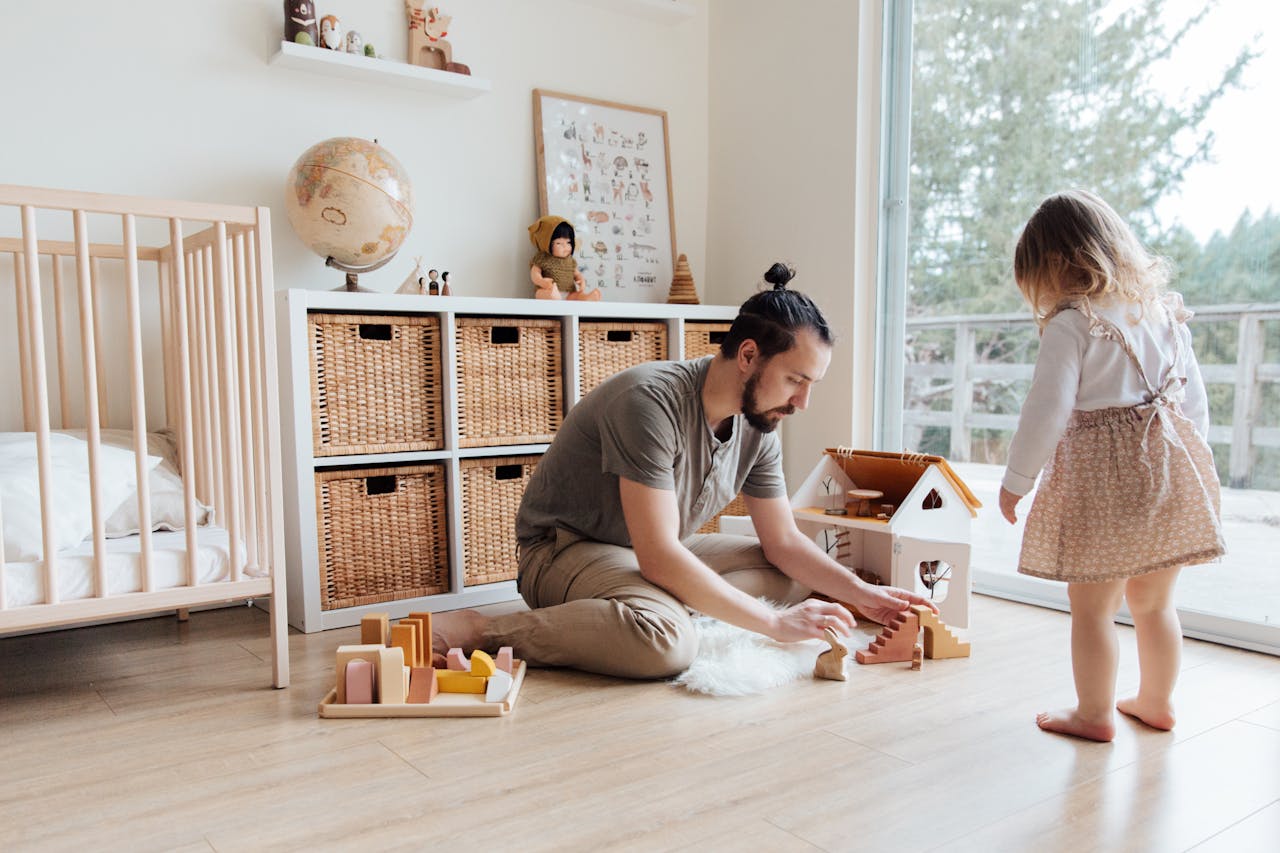 Home Father engaging with daughter in a playful indoor setting, building memories.