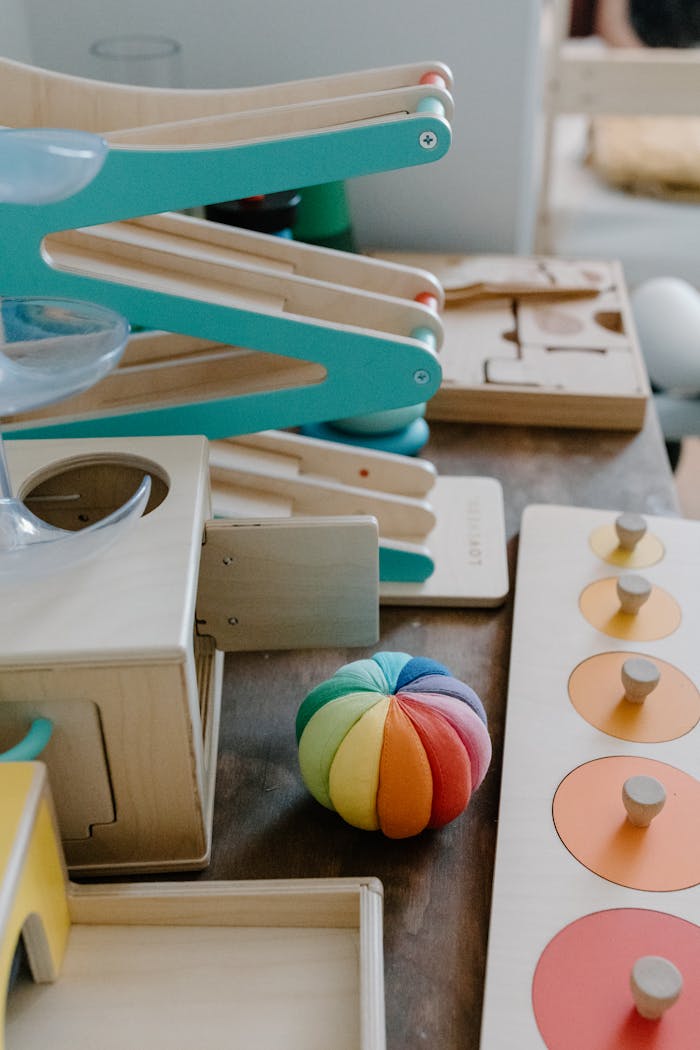 Montessori-style colorful wooden toys on a table promoting educational play for children.